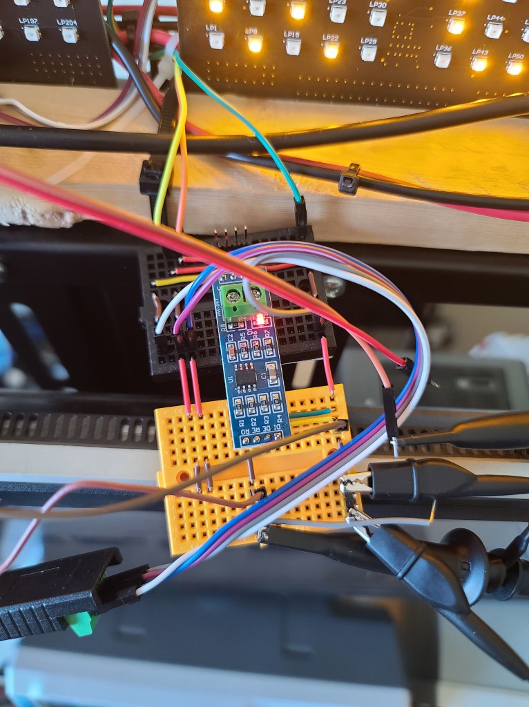 An RS485 transceiver connected to the device under test, a host PC, and two oscilloscope probes.